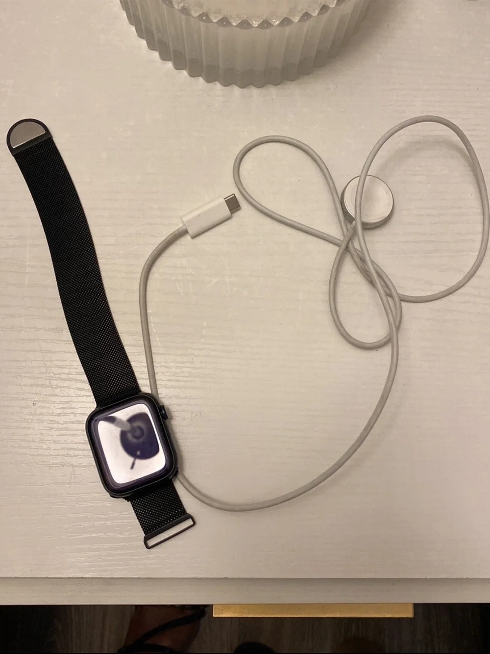 Apple Black Smartwatch with White Magnetic Charger